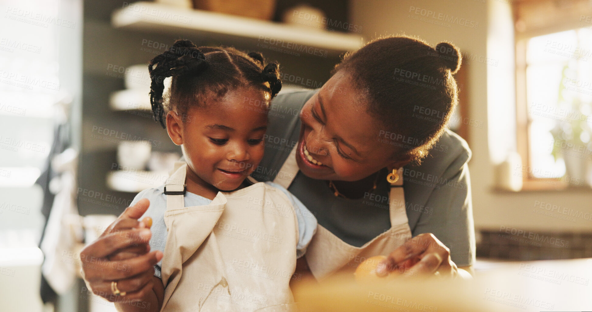 Buy stock photo Support, child and black mother in kitchen for baking, recipe process and pride at home. Young girl, development and mom at counter for trust, growth and encouragement for making cookies or cake