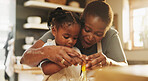 Education, child and black woman in kitchen for baking, recipe or help cracking egg at home. Girl, development and mother at counter for growth, learning or fun activity for making dough for cookies