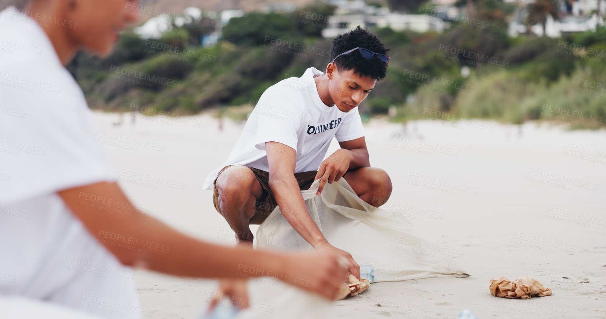 Buy stock photo Man, volunteer and cleaning on beach for environment care, recycling and social responsibility. People, NGO drive and trash in nature for Earth Day, support and collaboration for go green at ocean