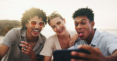 Buy stock photo Beach, funny face and selfie of friends on holiday, summer or travel on tropical island. Picture, men and woman at sea outdoor with tongue out, laugh or happy influencer post memory on social media