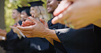 Education, hands and students clapping at graduation for academic milestone and degree achievement. University graduate, applause and support at outdoor ceremony for success, college diploma or event