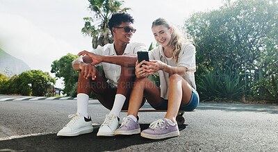 Buy stock photo Happy, phone or couple in skateboard park with fashion news or meme on holiday date to relax on weekend. Smile, video streaming or people on mobile app on summer vacation in interracial relationship