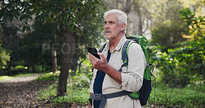 Buy stock photo Hiking, cell and mature man in nature for directions, navigation app and checking route. Lost, low signal or male ecologist in woods with phone, connectivity and location tracking error in wilderness