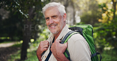 Buy stock photo Hiking, mature man and portrait in forest for fitness adventure, retirement hobby and wellness cardio. Senior, person and happy with backpack for trekking, explore and holiday sightseeing in woods