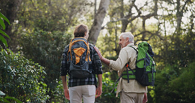 Buy stock photo Father, son and hiking for fitness outdoor with backpacking support, trekking adventure and morning journey in forest. Senior man, family and comfort for travel exercise, bonding and explore nature