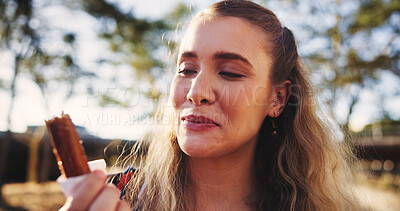 Buy stock photo Happy, park and woman with chocolate and smile for sugar snack, sweet treats and dessert outdoors. Relax, weekend and person with candy bar for eating, hungry and enjoy comfort food in nature