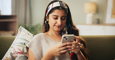 Buy stock photo Home, relax and woman with phone on sofa for dating app, notification and online communication. House, person and typing of message with technology for profile match, response or digital conversation