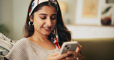 Buy stock photo Relax, happy and woman with phone in home for dating app, notification or online communication. Person, smile and typing of message with technology for digital conversation, response or profile match