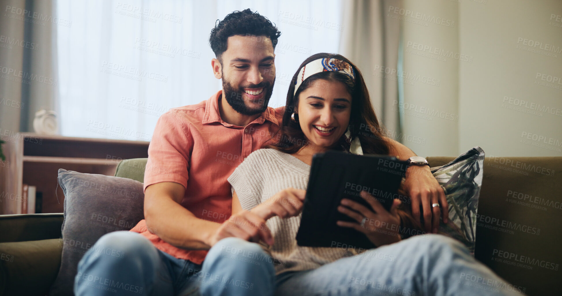 Buy stock photo Couple, hug and tablet together on couch, home and watching video or online streaming for movies or bonding. Internet, networking and social media in living room with man and woman, care or affection