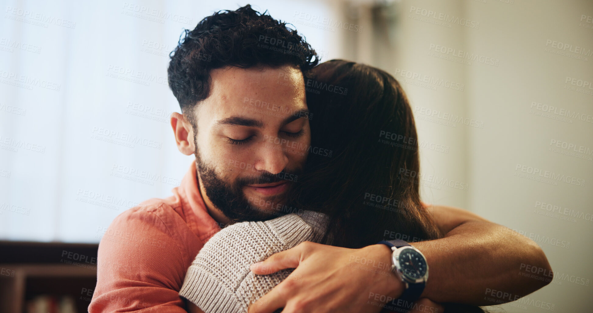 Buy stock photo Couple, hug and love with smile in home with support, care or bonding for connection in relationship. Man, woman and embrace in lounge, relax or happy with eyes closed for memory at house in Colombia