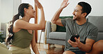 Happy couple, fitness and high five with phone for success, teamwork or workout goals together at home. Excited man or woman touching hands for winning, achievement or completion on exercise at house