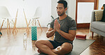 Calm man, meditation and namaste with mat for yoga, fitness or awareness on floor at home. Young male person or yogi in relax, stress relief or exercise for zen, inner peace or mindfulness at house