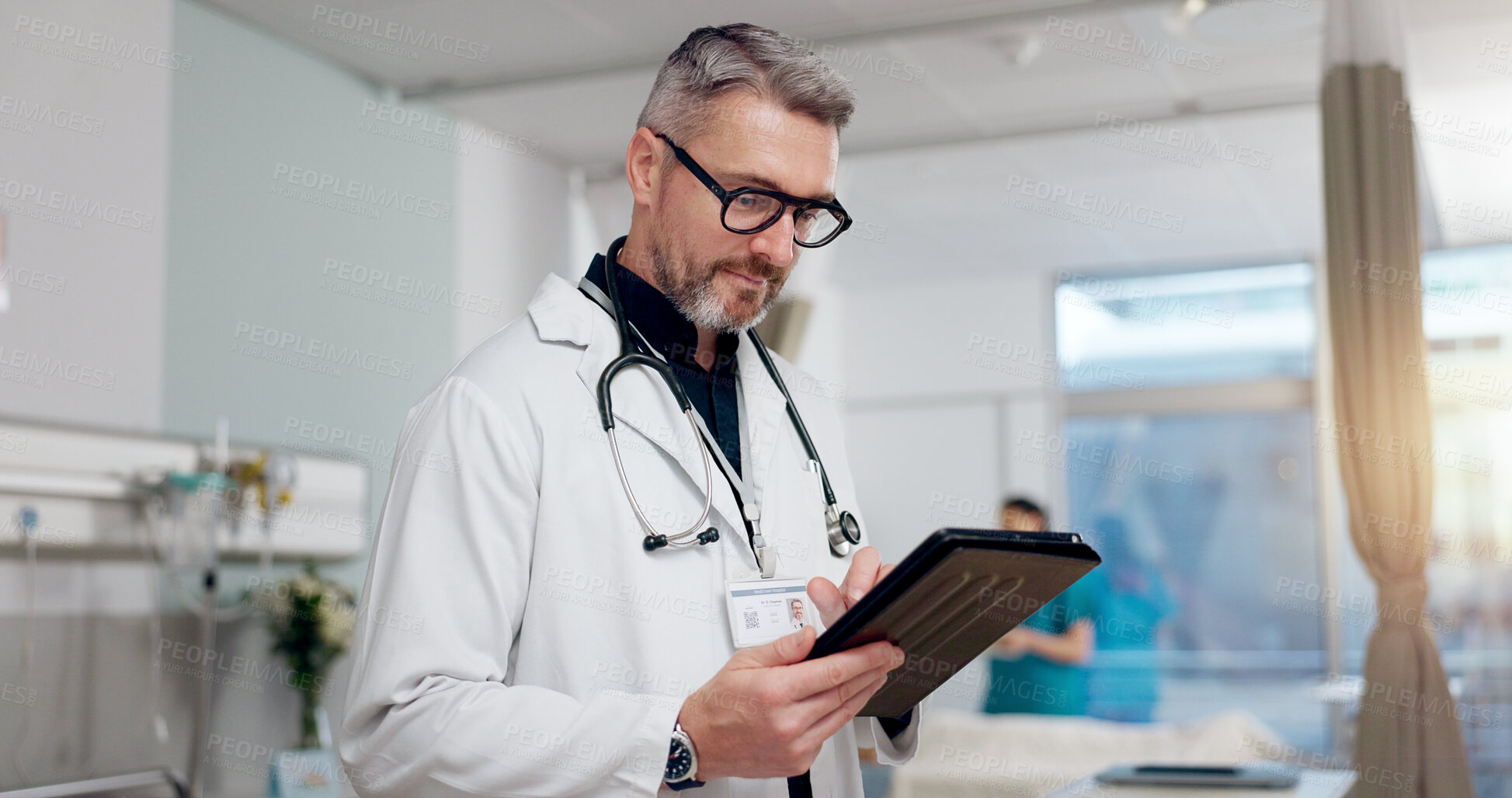 Buy stock photo Medical, doctor and typing on tablet at clinic for Telehealth consultation, healthcare charts and health records. Man, digital and surgery schedule, prescription information and treatment compliance