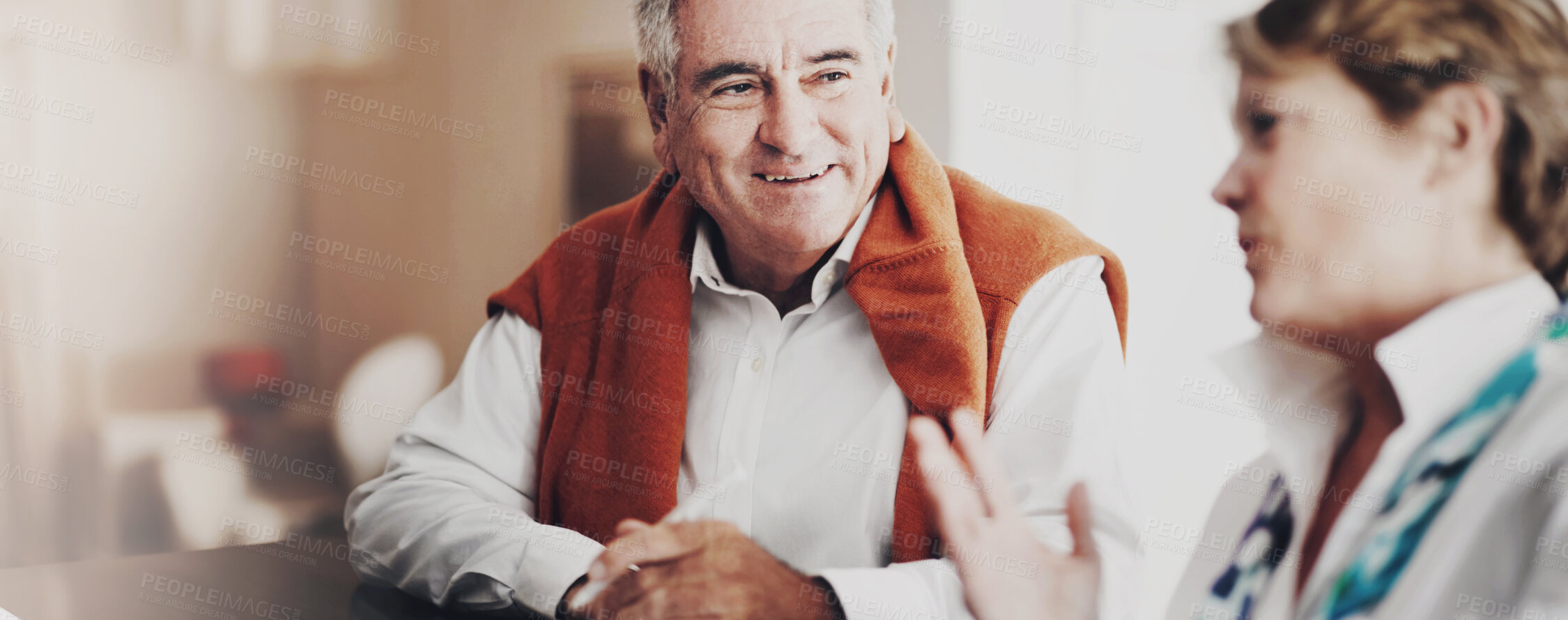 Buy stock photo A senior man and his wife filling out forms at a hotel reception desk