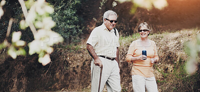 Buy stock photo A senior couple out for a walk in the forest together