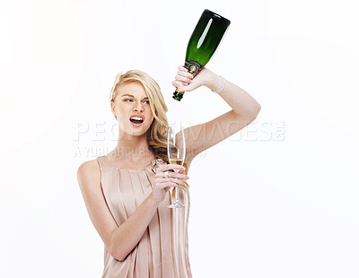 Buy stock photo A gorgeous young blonde woman pouring herself the last drop of champagne