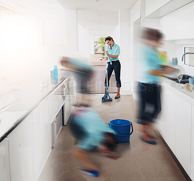 Buy stock photo Multiple clones of one young woman cleaning a kitchen