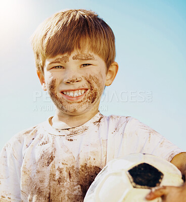 Buy stock photo Portrait, child and soccer ball in for fun, sport and confidence in outdoor playground or park. Little boy, smile and football as messy, muddy and dirty in garden for exercise, training and happiness