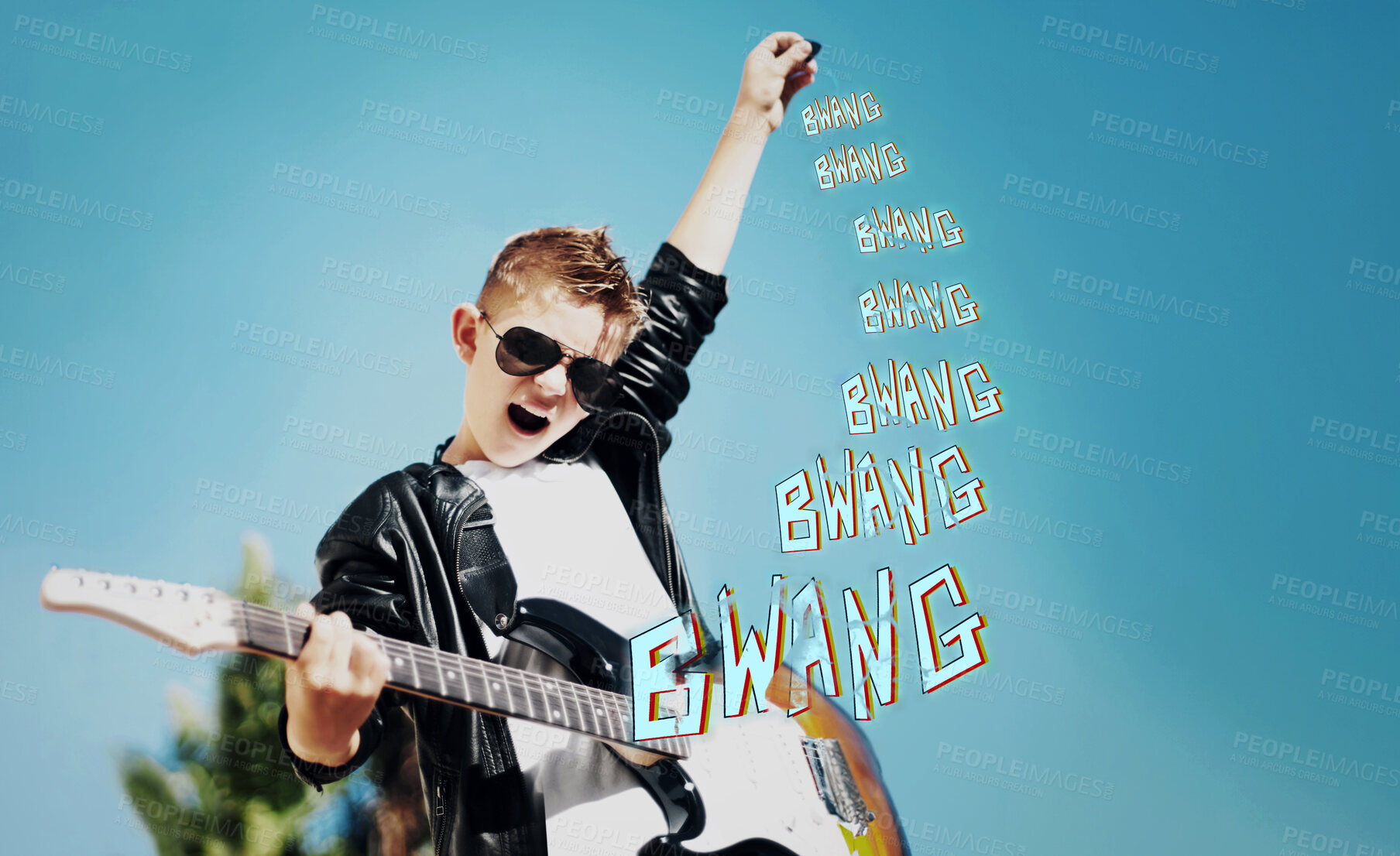 Buy stock photo Little boy playing the electric guitar with a rockstar attitude