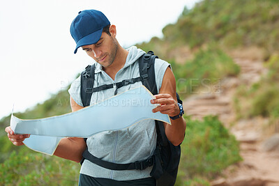 Buy stock photo Man, hiking and map for guidance, nature and direction on trail, fitness and exercise on holiday. Male person, lost and documents for information, travel and journey or adventure to forest for cardio