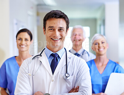 Buy stock photo Portrait, doctor and man with arms crossed, group and happy for leadership in hospital, proud and expert. Clinic, medical professional and confidence of people, healthcare and lab coat for employees