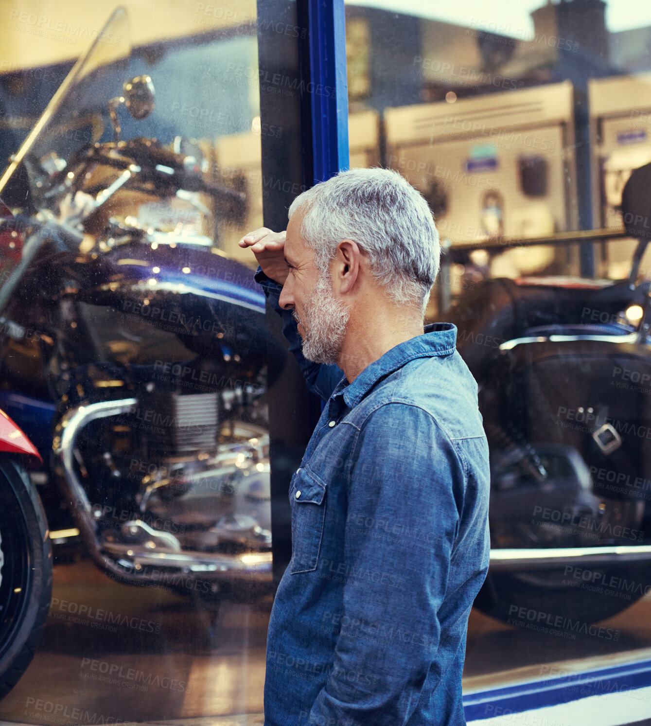 Buy stock photo Shop, window and man looking at motorcycle with dream, inspiration and budget planning for bike. Thinking, saving and mature person checking motorbike in store for travel, transport and decision.