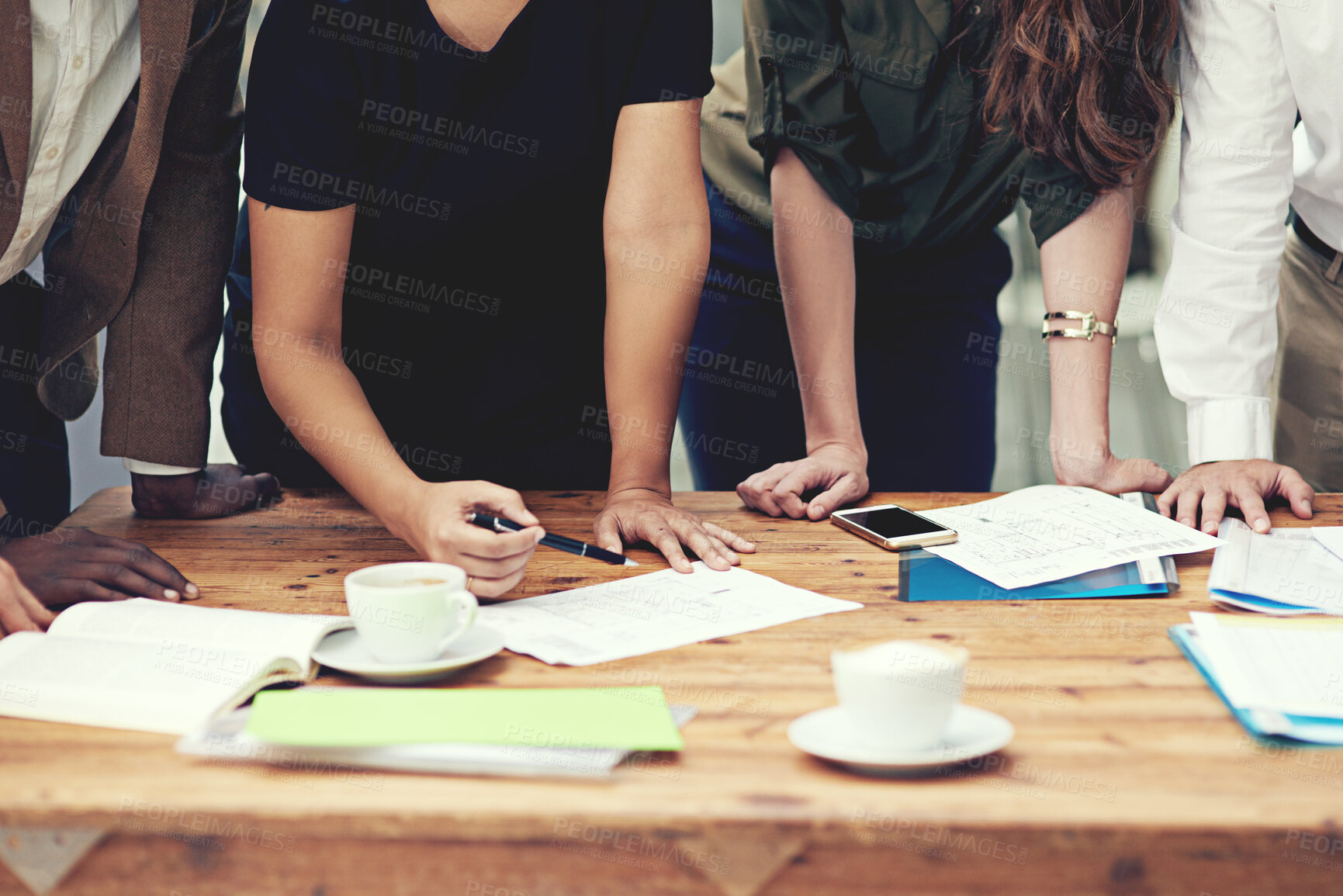 Buy stock photo Cropped shot of a group of businesspeople having a meeting in an office