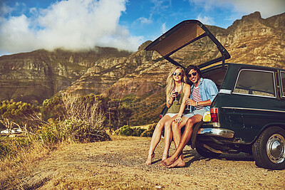 Buy stock photo Couple, car and sunset for road trip with drinks, adventure and freedom for transport together. Vehicle, summer and view for happiness in California, vacation and love for support and honeymoon