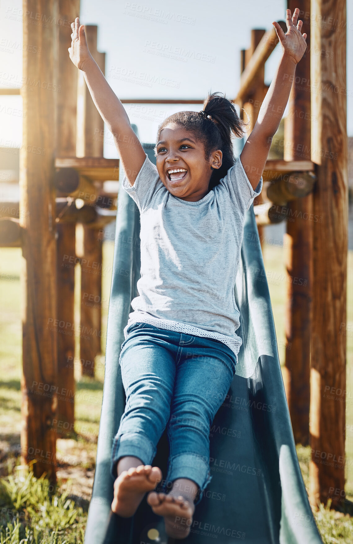 Buy stock photo Slide, happy and child in park for fun, excited and freedom for black girl, playing and outdoor for game. Summer, smile and kid with energy in playground, active and relax in break of elementary