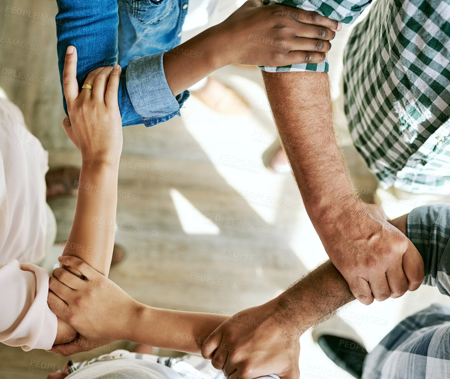 Buy stock photo Business people, holding hands and support in office with teamwork, solidarity or partnership goals. Diversity synergy, employees or group collaboration with top view for unity, cooperation and trust