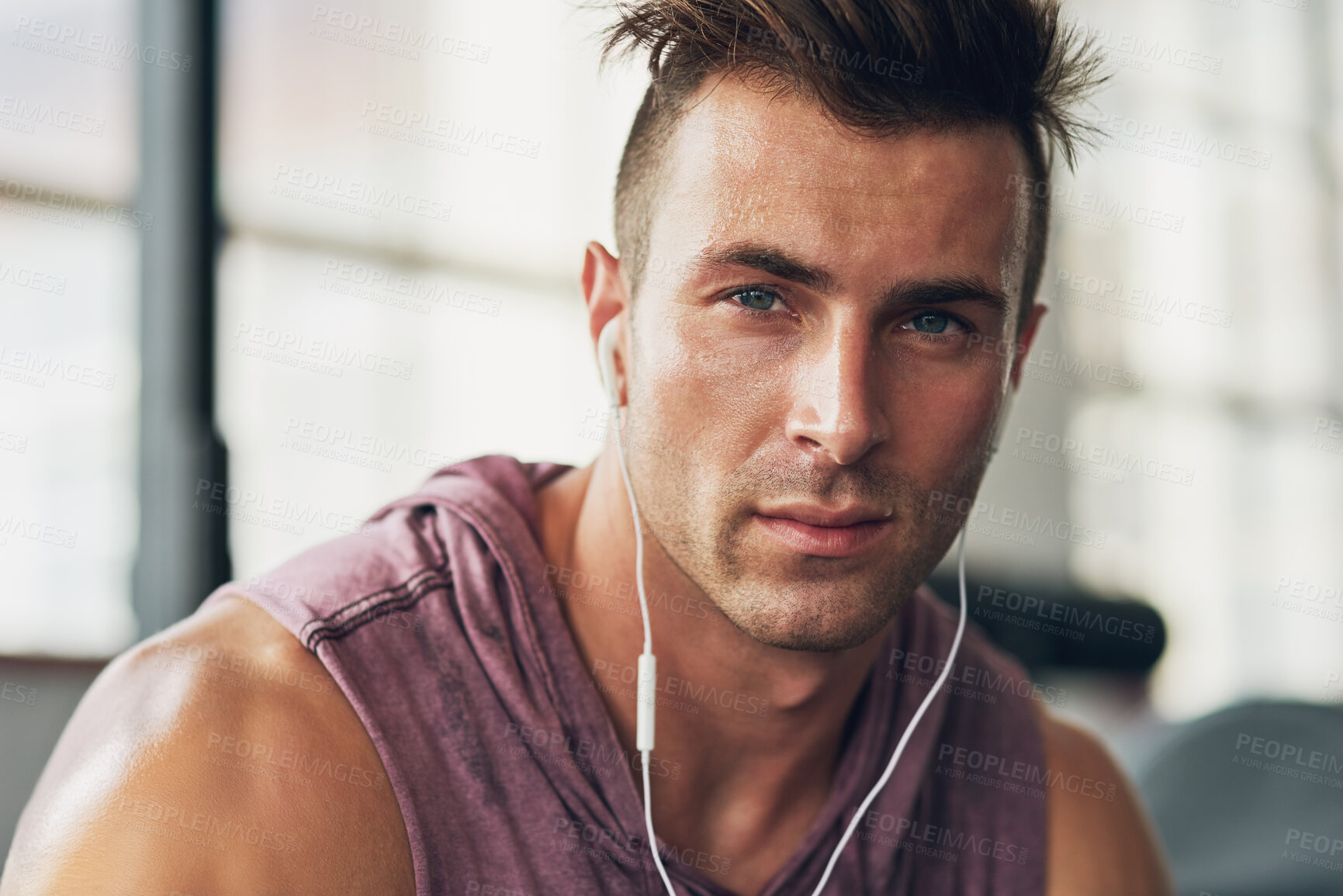 Buy stock photo Shot of a handsome young man at the gym