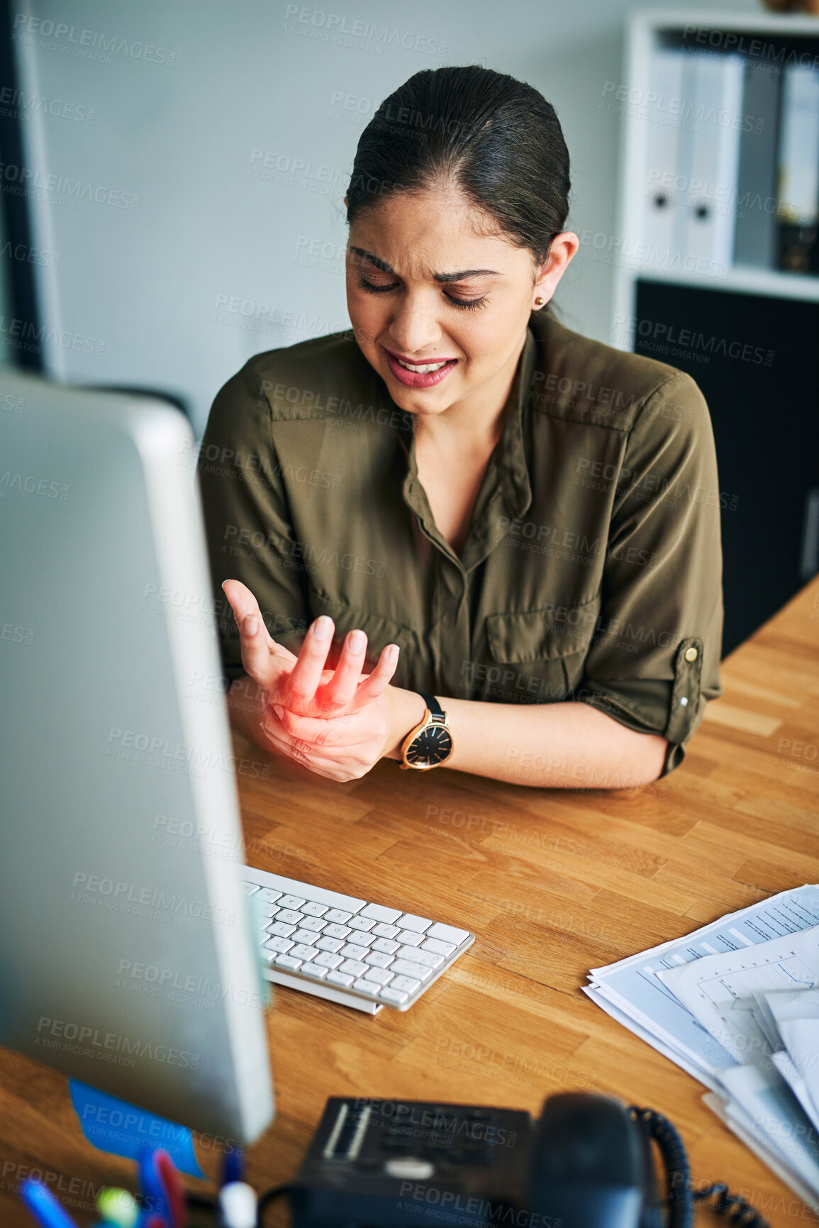 Buy stock photo Woman, employee and hand pain in office, injury and computer for typing injury and arthritis. Female person, fibromyalgia and professional in workplace for red glow, joint strain and inflammation