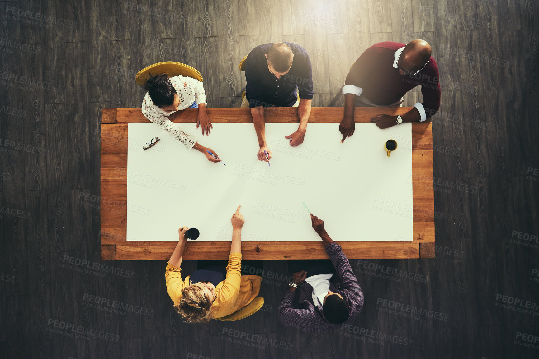 Buy stock photo Business people, hands and planning mockup above in meeting for team collaboration at office. Creative group discussion, teamwork and strategy for brainstorming, diversity and startup at workplace