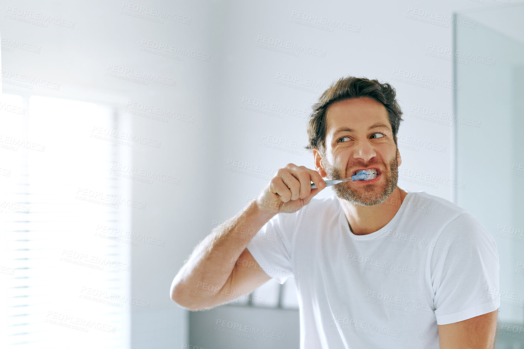 Buy stock photo Dental care, man or brushing teeth in bathroom for hygiene, whitening or routine clean in morning. Male homeowner, oral wellness and wash mouth at home for fresh breath, results and ready for work