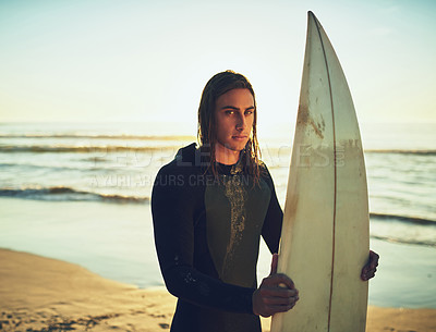 Buy stock photo Man, surfboard and portrait at ocean for fitness, training programme and competition preparation. Athlete, surfer and sunset at beach with sport, recreational activity and confidence in Australia