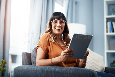 Buy stock photo Woman, tablet and portrait on sofa for streaming movie, relax and social media with communication. Female person, technology and happy on couch for film, subscription and online shopping in house