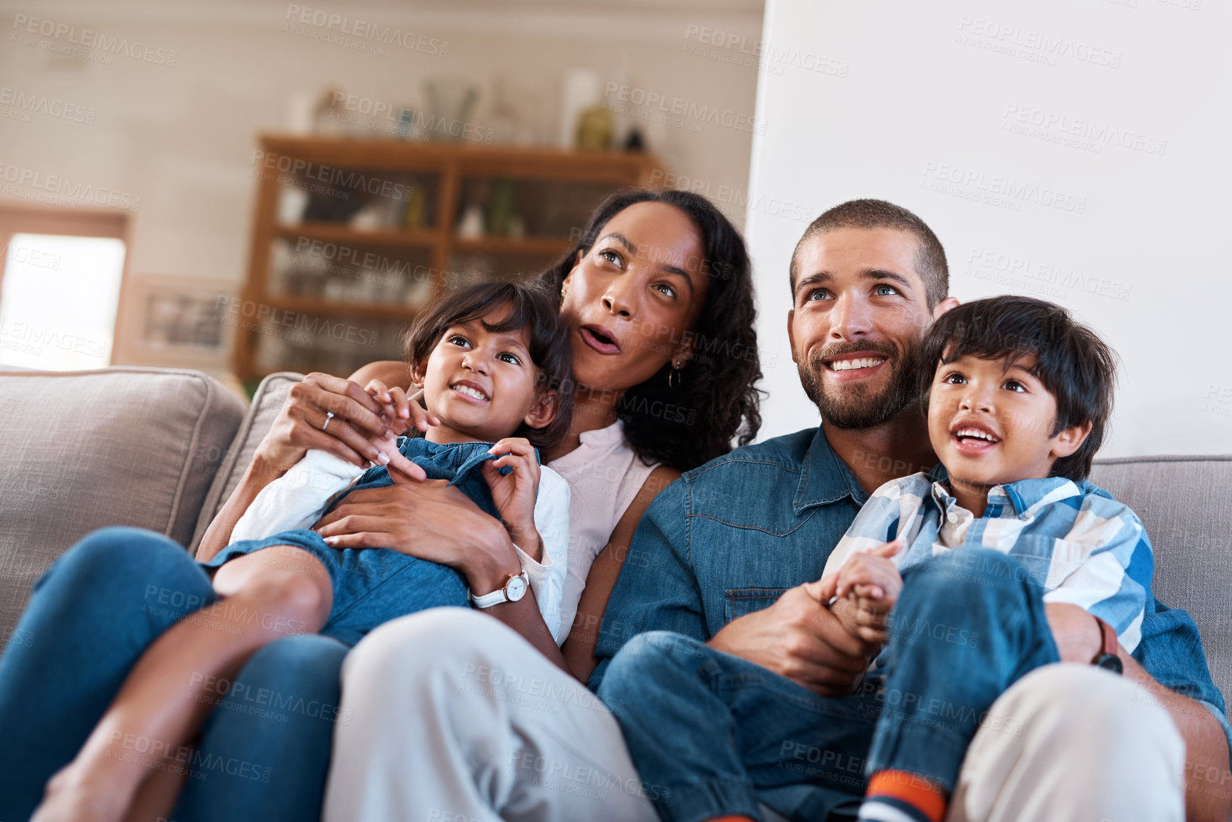 Buy stock photo Happy, TV and parents with children on sofa in home for bonding, chill and watching movies in living room. Joy, family and mom, dad and kids on couch streaming cartoons, entertainment and series