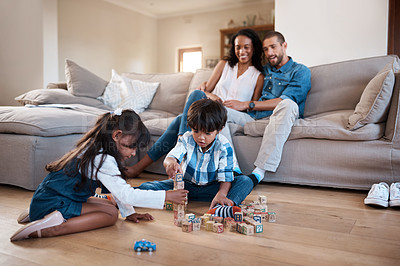 Buy stock photo Kids, building blocks and playing in home, learning and siblings bonding together on lounge floor. Children, brother and sister for educational toys, parents watching and love for mind development