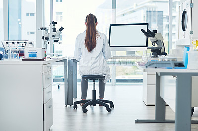 Buy stock photo Science, space and woman in laboratory with computer screen for vaccine development in medical study. Biotech engineer, technician or scientist in research for pharmaceutical innovation from back