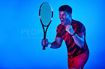 Buy stock photo Happy man, tennis and sports with winner in studio for victory, league or tournament on a blue background. Young, male person or athlete in celebration for championship or competition on mockup space