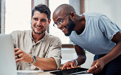 Buy stock photo Cropped shot of a handsome young businessman helping a male colleague in the office