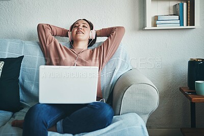 Buy stock photo Woman, laptop and smile with music for audio, blog or article in home living room. Journalist, headphones and inspiration for remote work, planning or research for freelance copywriting on sofa