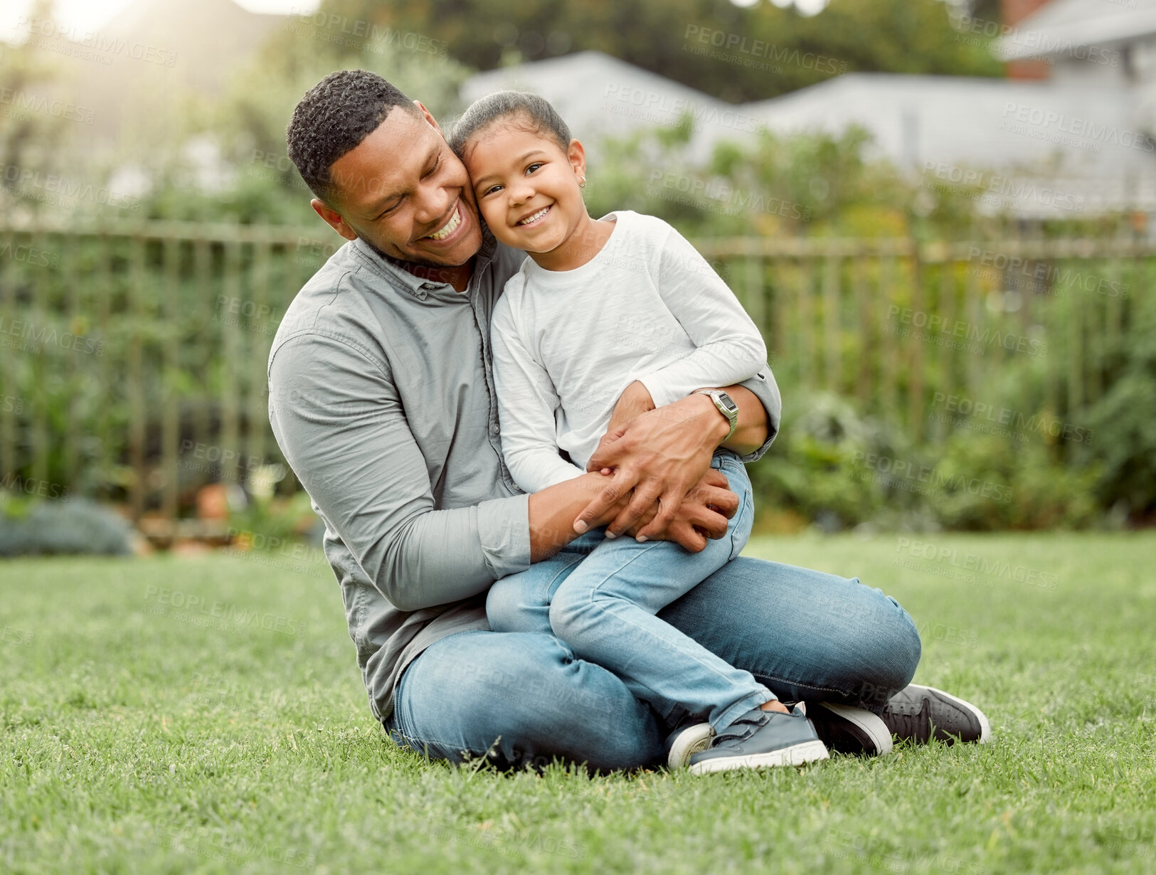 Buy stock photo Smile, father and hug child at backyard for love, care or family bonding together to relax. Dad, kid or embrace girl on grass outdoor for connection, support and single parent celebrate custody win