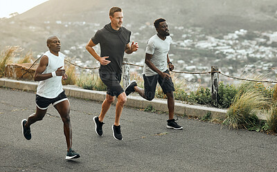 Buy stock photo Shot of a group of men exercising in nature