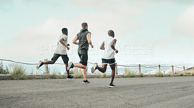 Buy stock photo Shot of a group of men exercising in nature