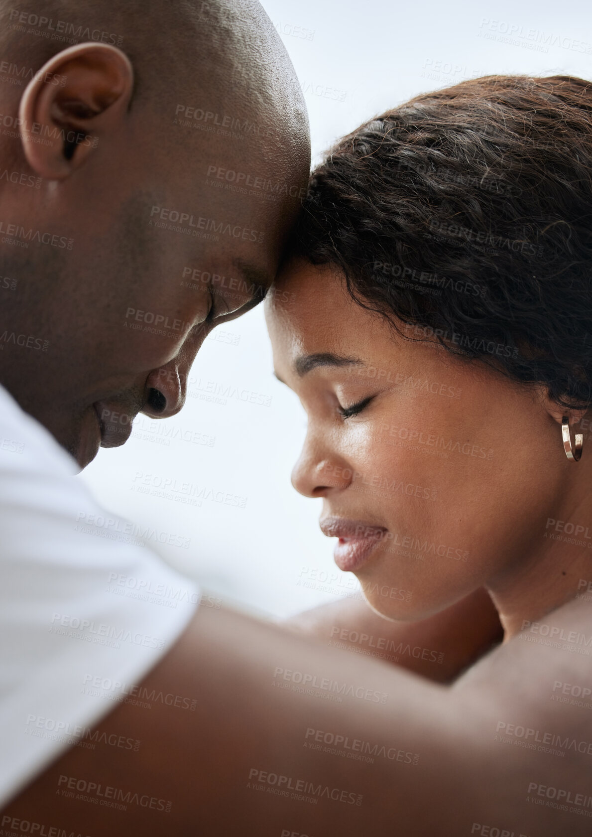 Buy stock photo Outdoor, black couple and forehead touch with eyes closed in love for support, care and bonding. People, relationship and outside with trust for solidarity, respect and comfort as lovers in closeup