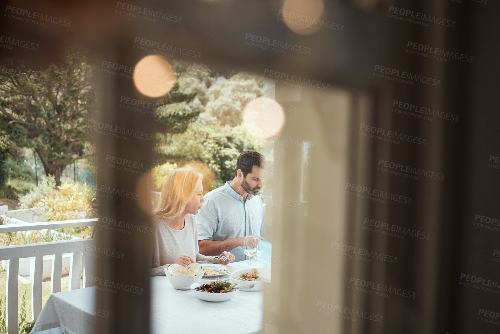 Buy stock photo People, home and patio in eating lunch or meal for thanksgiving, celebration and event. Family gathering, happiness and joy with food, table and nutrition for healthy diet, feast and festive holiday