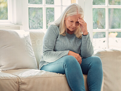 Buy stock photo Stress, headache and senior woman in home with regret, worry or thinking of past trauma. Depression, retirement and sad person with mental health challenge, financial crisis or anxiety in living room