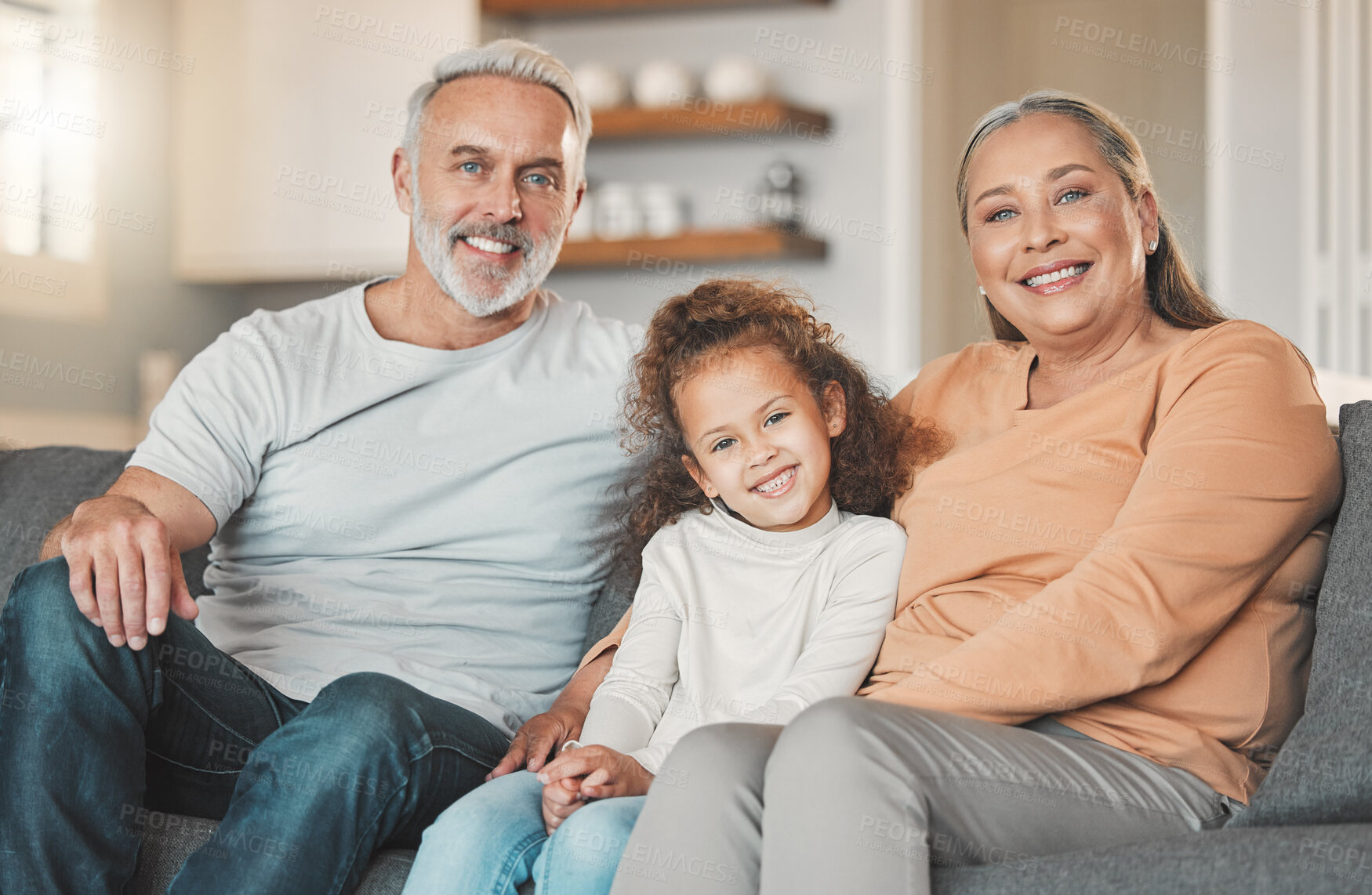 Buy stock photo Grandparents, girl and family portrait in home, weekend visit and relax together for bonding. Grandchild, embrace grandmother and love grandpa in Argentina, happiness and care for kid in relationship