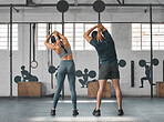 Fit, active and healthy gym couple stretching, getting ready and preparing for workout, training and exercise in wellness center. Sporty, athletic or strong man and woman warming up for weightlifting